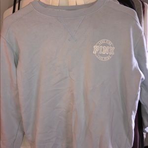 a light blue victoria secret crew neck